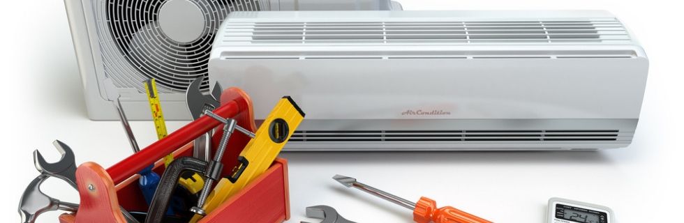 Air conditioning unit with tools for maintenance and repair, emphasizing HVAC services and energy efficiency.